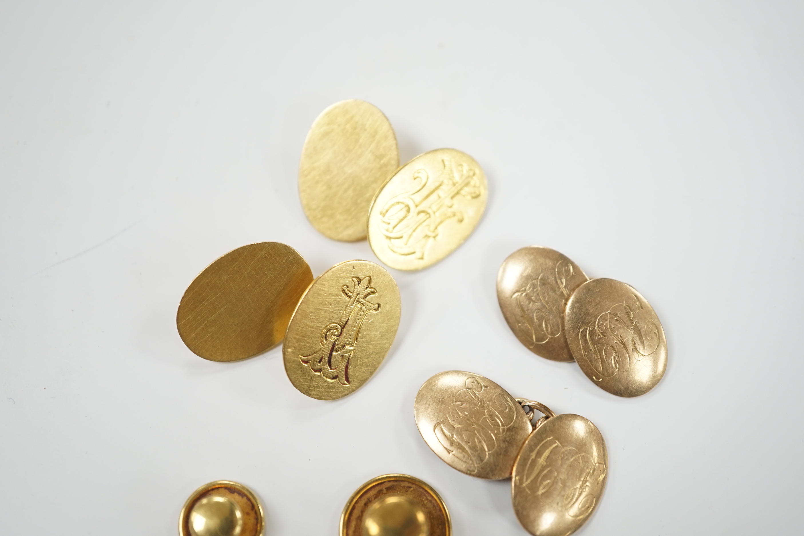 A pair of 18ct gold oval cufflinks, with engraved monogram, three 18ct dress studs and a pair of 9ct gold oval cufflinks